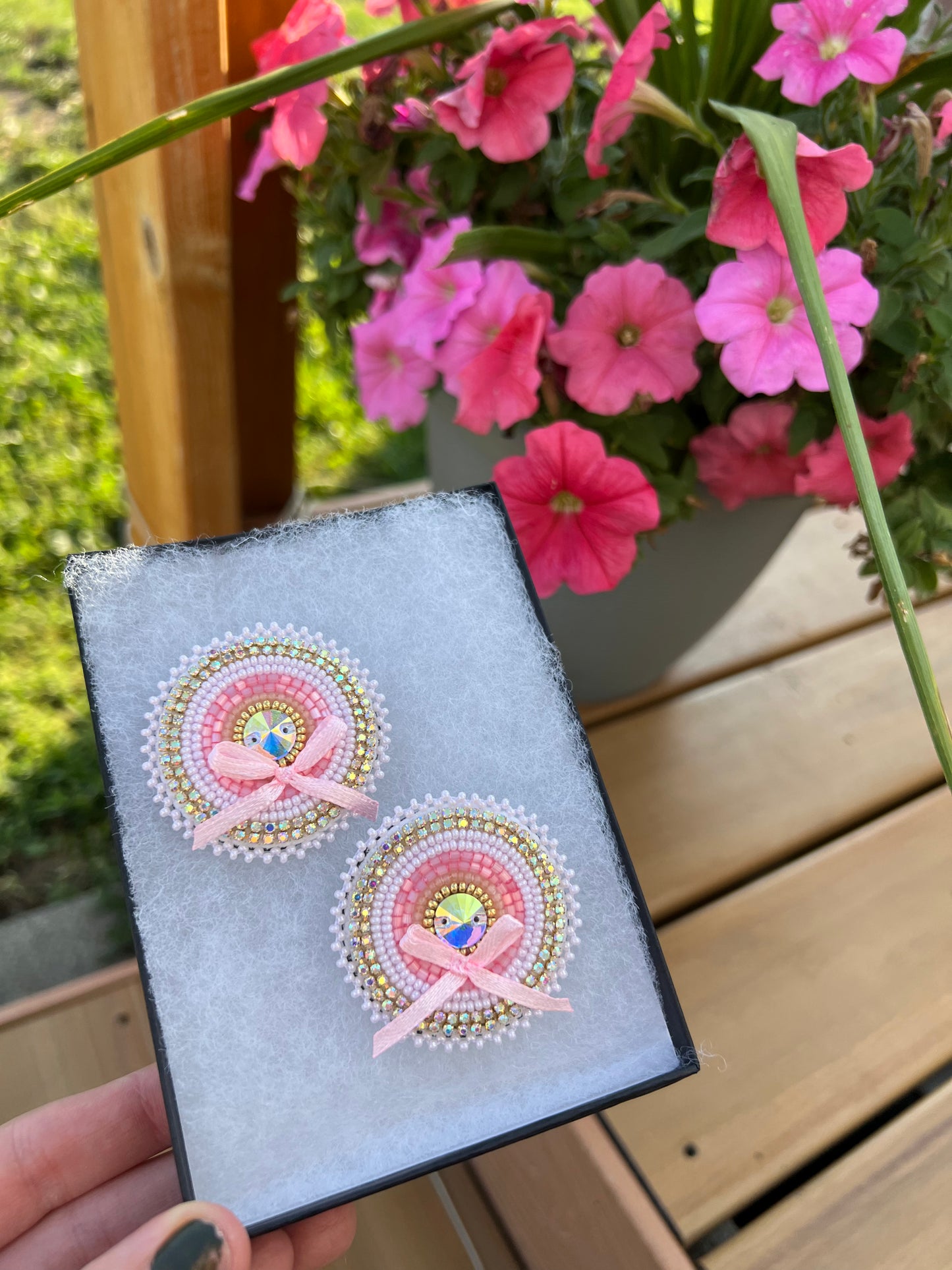 Pink beaded earrings with bows.